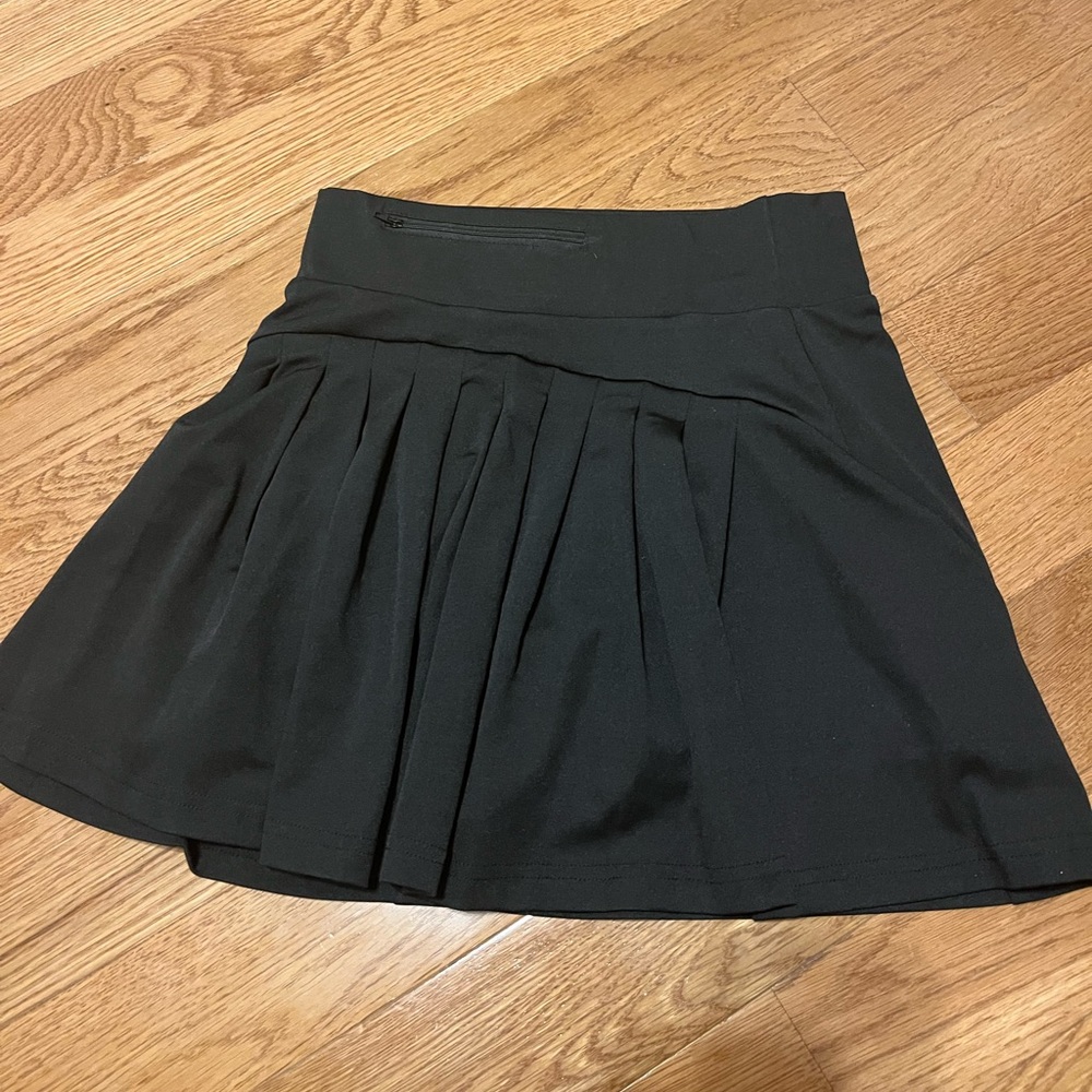 Black Tennis Skirt. Never been worn. Perfect condition.